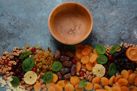 Mix of dried and sun-dried fruits, and nuts. Kiwi, apricot. Symbols of the Jewish holiday of Tu BiShvatの写真素材