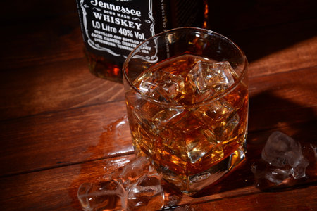 Netanya, Israel - January 30, 2021: Jack Daniel's, a brand of American whiskey , produced by the Jack Daniel Distillery. Glass of whiskey and ice.のeditorial素材