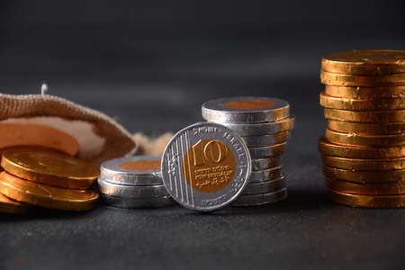 Stack of chocolate shekel coins as a concept for finance