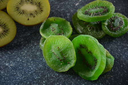Sliced kiwi fruit  in pieces  fresh and driedの写真素材