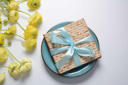 Table served for Passover (Pesach) indoors, with matzah bread as symbolic Pesach (Passover Seder)...