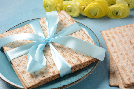 Table served for Passover (Pesach) indoors, with matzah bread as symbolic Pesach (Passover Seder)...
