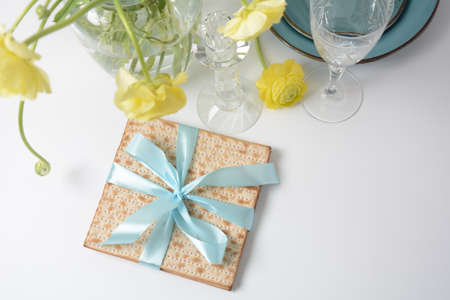 Table served for Passover (Pesach) indoors, with matzah bread as symbolic Pesach (Passover Seder)...