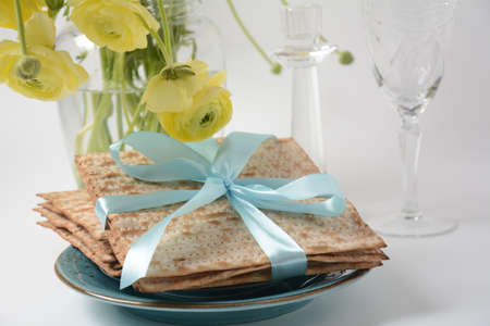 Table served for Passover (Pesach) indoors, with matzah bread as symbolic Pesach (Passover Seder)...