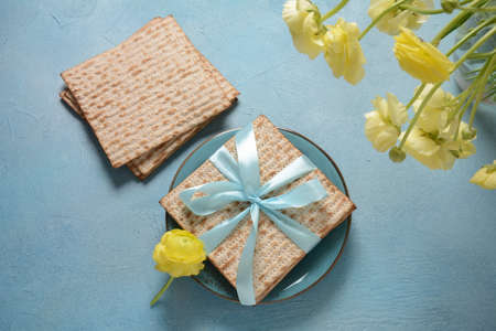 Table served for Passover (Pesach) indoors, with matzah bread as symbolic Pesach (Passover Seder)...