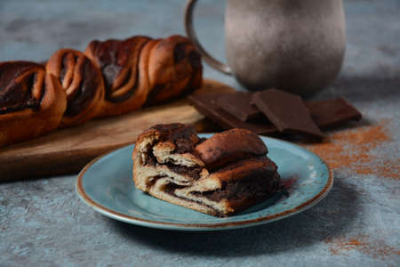 Babka or Brioche Bread. Stuffed with hazelnut cream. Traditional Jewish bread-like cake swirled with chocolate or cinnamon and topped with nuggets of cinnamon-sugar streusel.の写真素材