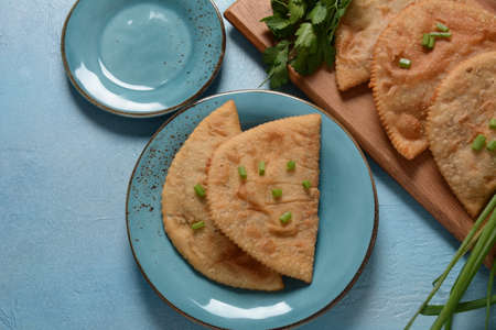 Chebureki - fried pies with meat and onions. Caucasian cuisine - is a patty made from thin...