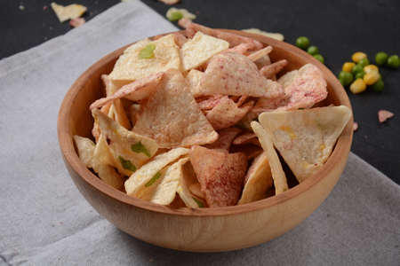 Ð¡hips made from rice and beans with different flavors.  Healthy Gluten Free rice chips in a bowl