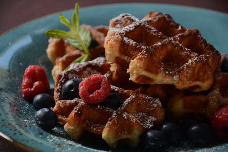 Traditional belgian waffles with fresh fruit  or american waffles delicious sweet dish, dessert...