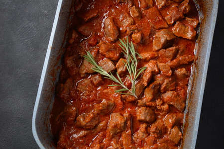 Beef stew with rosemary in a bowlの写真素材