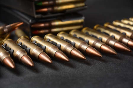 Photo of 5.56mm Ammunition, machine gun bullets belt, rifle ammunition in magazines