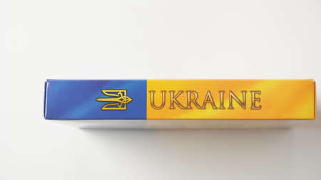 Ukraine flag and coat of arms. Golden trident on cloth flag. National symbol. Blue-yellow flag of Ukraine.の写真素材