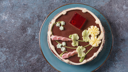 A Kyiv cake on a blue plate. It's a brand of dessert cake made in Kyiv, Ukraine. Kyiv cake with...