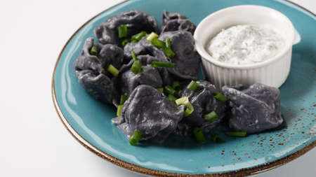 Colorful dumplings stuffed with meat. Colorful dumplings are a traditional delicacy in the eastの写真素材