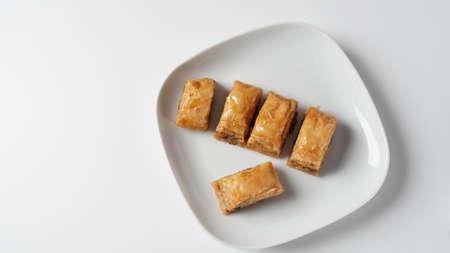 Baklava a layered pastry dessert made of filo pastry, filled with chopped nuts, and sweetened with syrup or honey.の写真素材