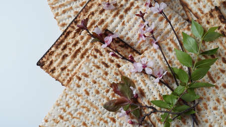 Table served for Passover (Pesach) indoors, with matzah bread as symbolic Pesach (Passover Seder) item.の写真素材