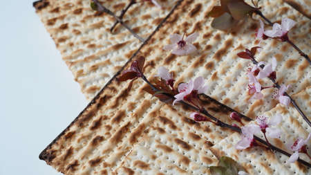 Table served for Passover (Pesach) indoors, with matzah bread as symbolic Pesach (Passover Seder) item.の写真素材
