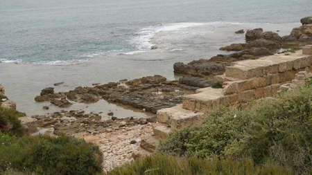 The ruins of the ancient Biblical, Phoenician, Israelite and Roman port of Dor. Famous historical archaeological site in Israel, Mediterranean Seaの写真素材