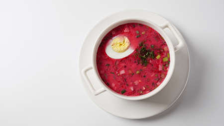 Belorussian, Latvian, Lithuanian, Polish, and Ukrainian Beetroot cold creamy soup with cucumber, radish, potatoes and egg . Traditional Summer soup conceptの写真素材