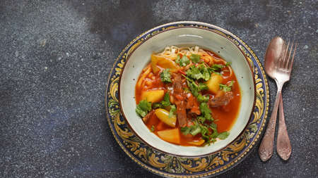 Traditional asian noodle soup with vegetables, potatoes and meat, - lagman. Oriental, uzbek style...
