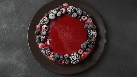 Berry jelly cake with frozen strawberries, blueberries, raspberries