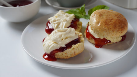 British scones with fruit jam and whipped creamの写真素材