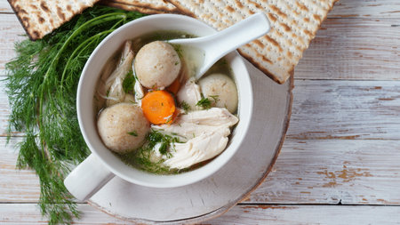 Chicken Matzo ball soup with carrots in the bowl. Jewish traditional Passover holiday foodの写真素材