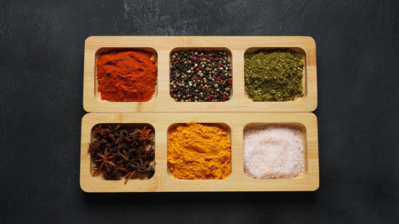 Trays with bright oriental spices and seasoningsの写真素材