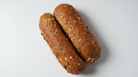 Freshly baked bread buns. Rolls of dark flour with oat flakes