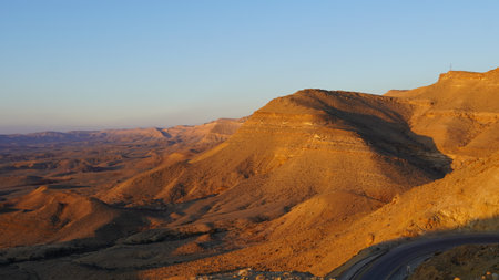 Sunrise view of HaMakhtesh HaGadol the big crater, in the Negev Desert, Southern Israel. It is a geological landform of a large erosion cirqueの写真素材