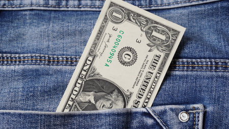 Money in the pocket of jeans. One dollar billの写真素材