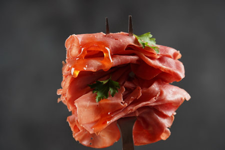 Skewed with a bbq fork dried beef meat with herbs and spicyの写真素材