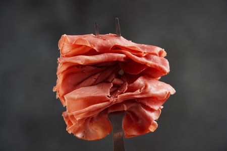 Skewed with a bbq fork dried beef meat with herbs and spicyの写真素材