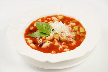 A bowl of minestrone soup with mix of vegetables. Italian cuisineの写真素材
