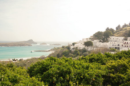 Lindos small whitewashed village and the Acropolis, scenery of Rhodos Island at Aegean Sea.の写真素材