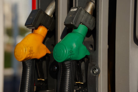 Netanya, Israel - October 11, 2023.Colorful Petrol pump filling nozzles. Gas station in a serviceのeditorial素材