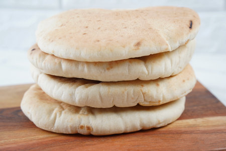 A stack of Pita bread(flat bread) on wooden board