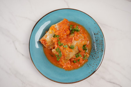 Cabbage rolls with chicken meat and rice in tomato sauce. Stuffed cabbage leaves. Delicious dinnerの写真素材