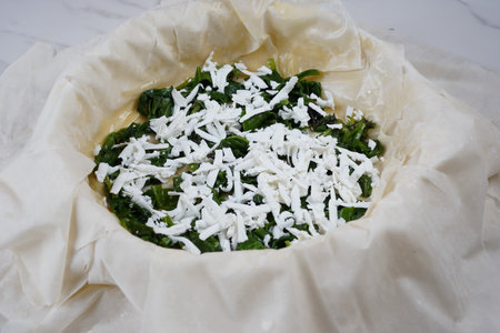 Cooking of Greek Pie with Spinach and salmon in fillo dough