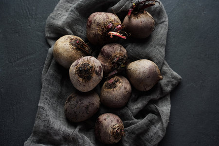 Beetroot on dark table. Beetroot on black kitchen table.の写真素材