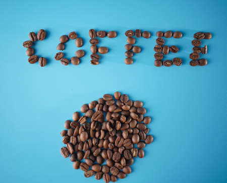 Roasted coffee bean. Coffee is good for health. One cup of coffee per day can make us clam until night. Blue background.の写真素材