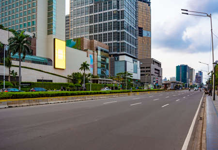 Jakarta, Indonesia - CIRCA May 2020: Empty MH Thamrin street in Central Jakarta. Public spaces are empty because people are working from home (stay at home) to reduce the spread of covid-19 pandemic.のeditorial素材