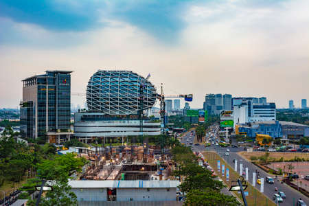 Tangerang, Indonesia - 26th Sep 2019: The scene at Gading Serpong Boulevard, Tangerang, Indonesia. JHL Solitaire Hotel is visible in the background.のeditorial素材