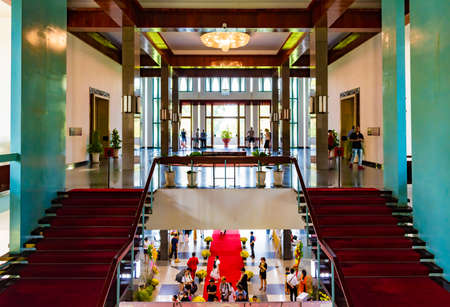 Ho Chi Minh City, Vietnam - CIRCA Jan 2020: A hall and stairs inside Independence Palace, Ho Chi Minh City, Vietnam; with a lot of tourists.のeditorial素材