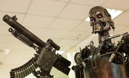 Robot (metal) assassin with automatic weapon