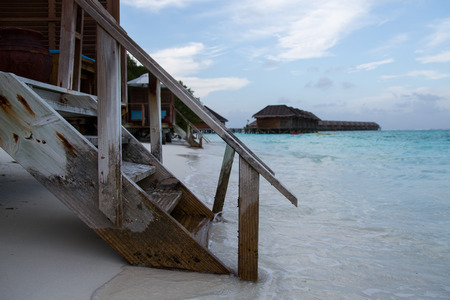 Stairs lead to water on the Maldivesの写真素材