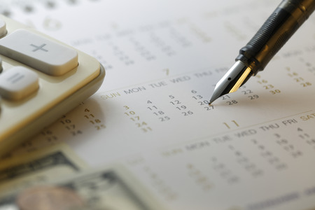 inancial settlement date  Calculator with calendar ?shot with very shallow depth of fieldの写真素材