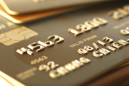Credit Cards close-up, shot with very shallow depth of field, gold toneの写真素材