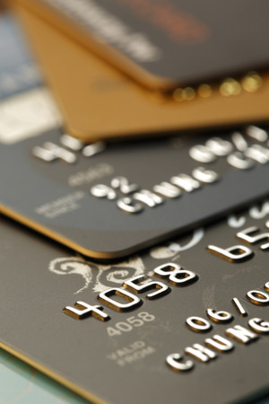 Credit Cards close-up, shot with very shallow depth of field, gold toneの写真素材