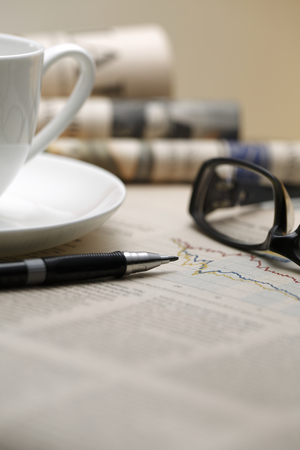 Black pen with financial figures and Glasses,shot with very shallow depth of field.の写真素材